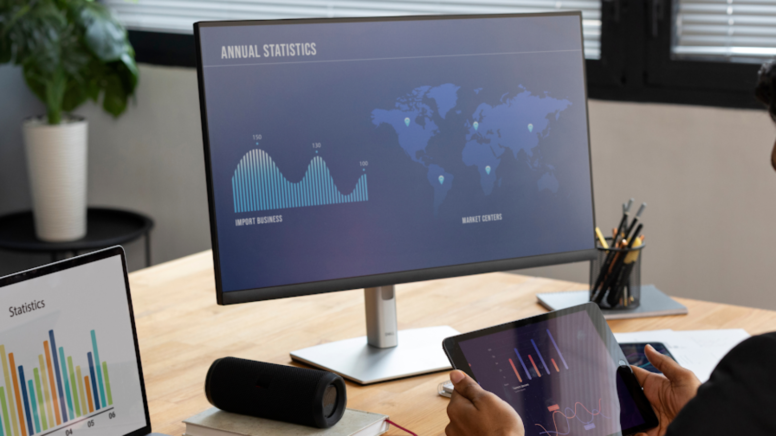 OTA manager reviewing performance dashboards with KPIs and travel market statistics.