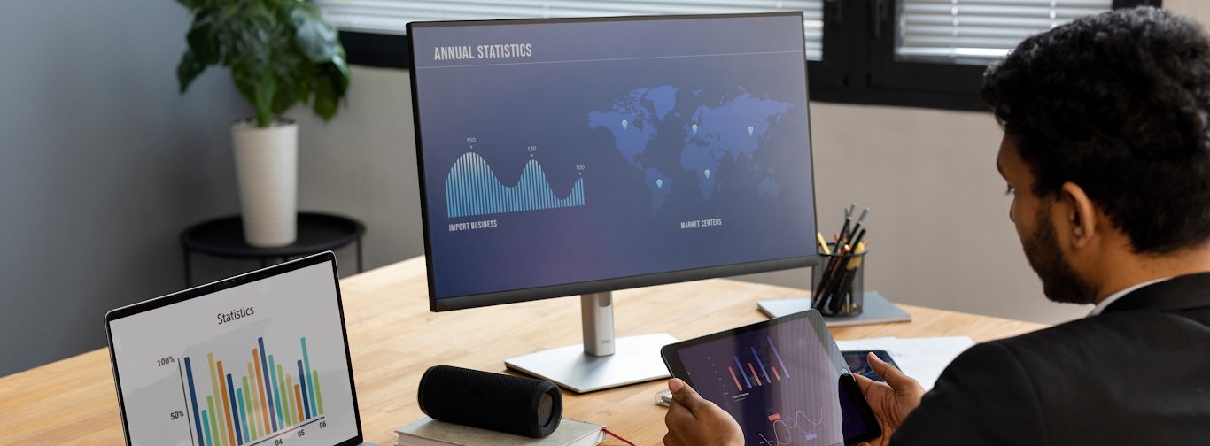 OTA manager reviewing performance dashboards with KPIs and travel market statistics.