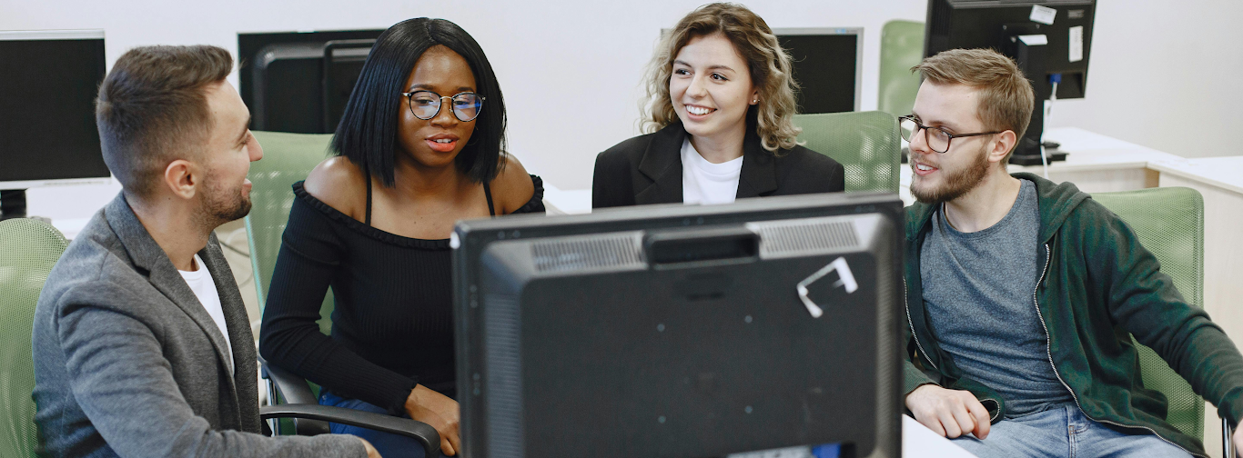 Team of professionals discussing options for selecting the best travel agency software.